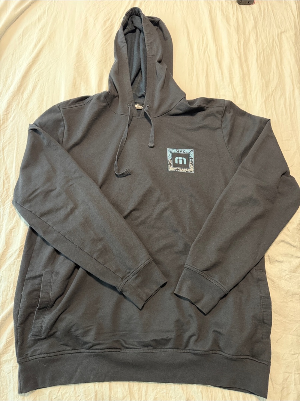 Travis Mathew Black Hoodie with Small Chest Patch